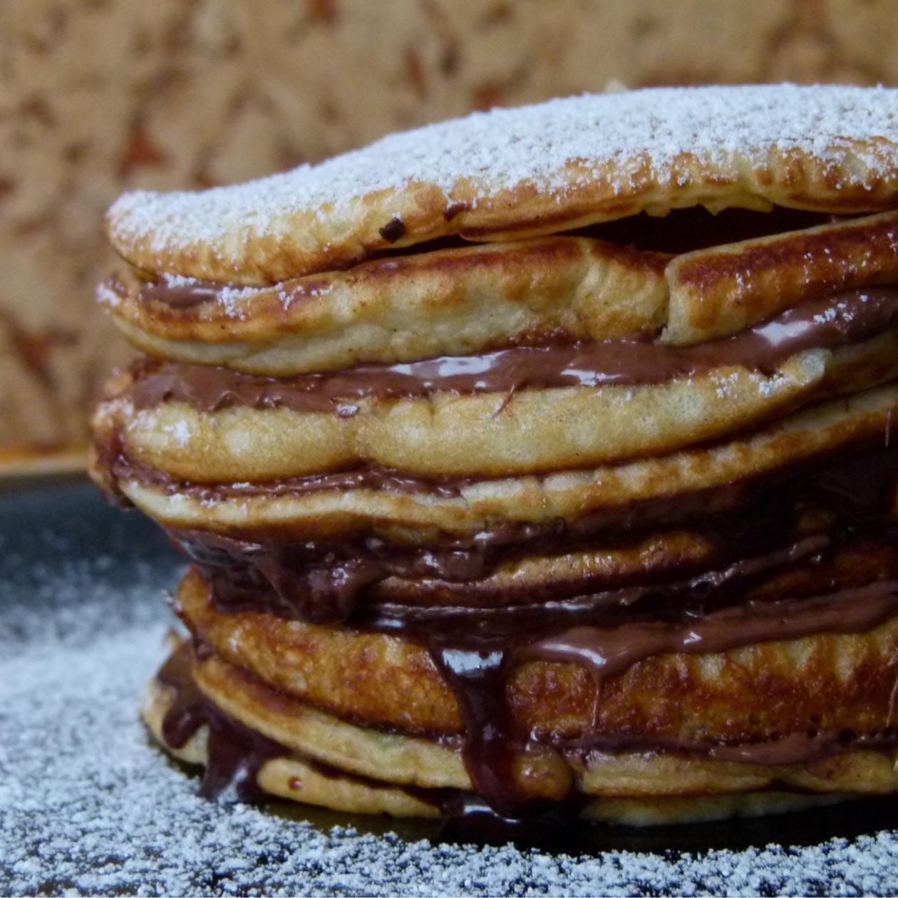 Pancakes layered with chocolate spread
